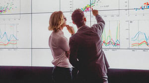 C2C cover men pointing at charts_0.jpg
